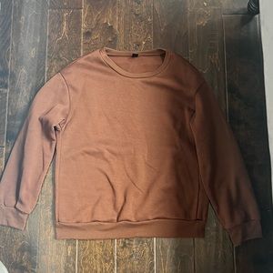 A brown comfortable baggy size medium sweatshirt.